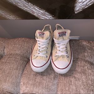 Cream converse sneakers with white bottoms